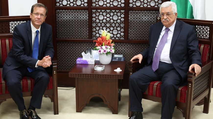 Israeli co-leader of the Zionist Union party and Labour Party's leader Isaac Herzog (L) meets with Palestinian Authority President Mahmud Abbas in the West Bank city of Ramallah on August 18, 2015. AFP PHOTO/ABBAS MOMANI (Photo credit should read ABBAS MOMANI/AFP via Getty Images)
